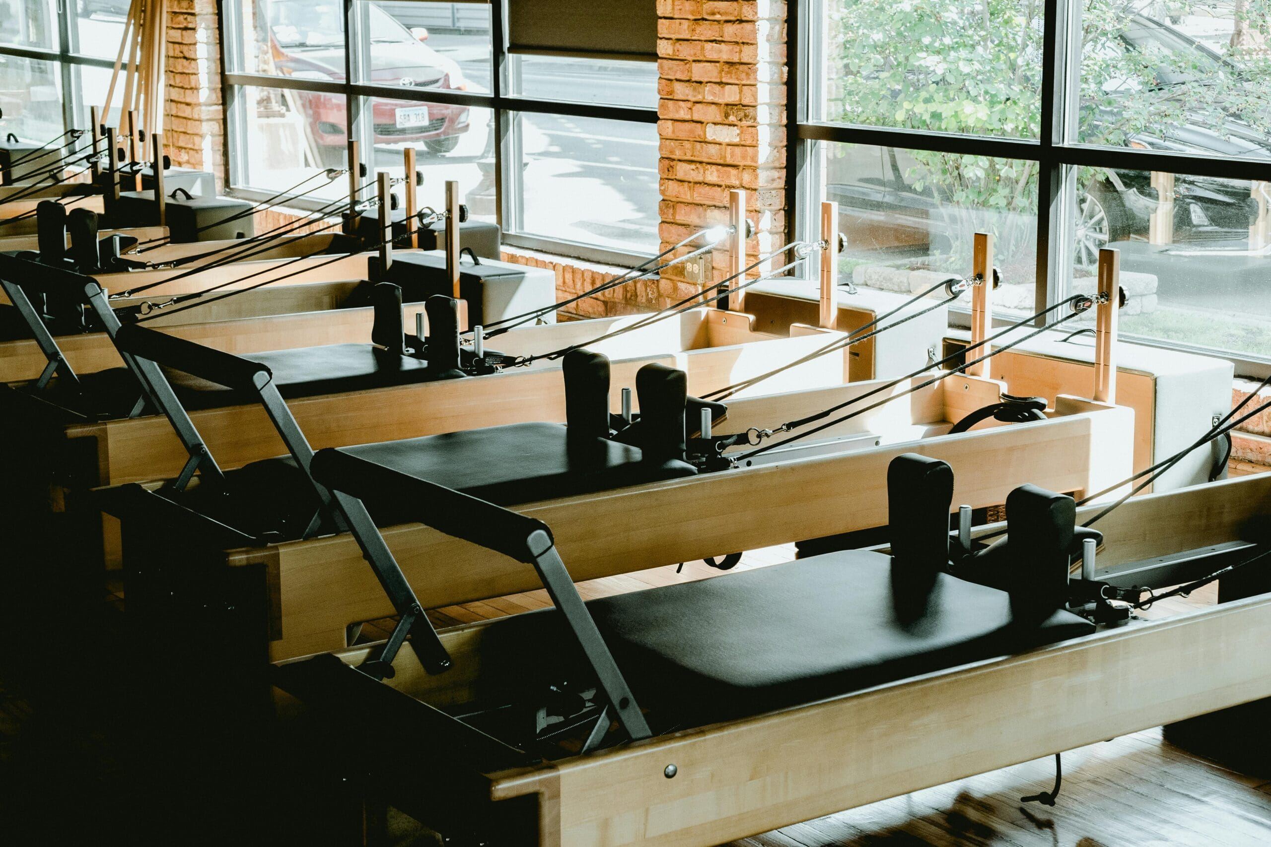 Light filled pilates studio with reformer machines