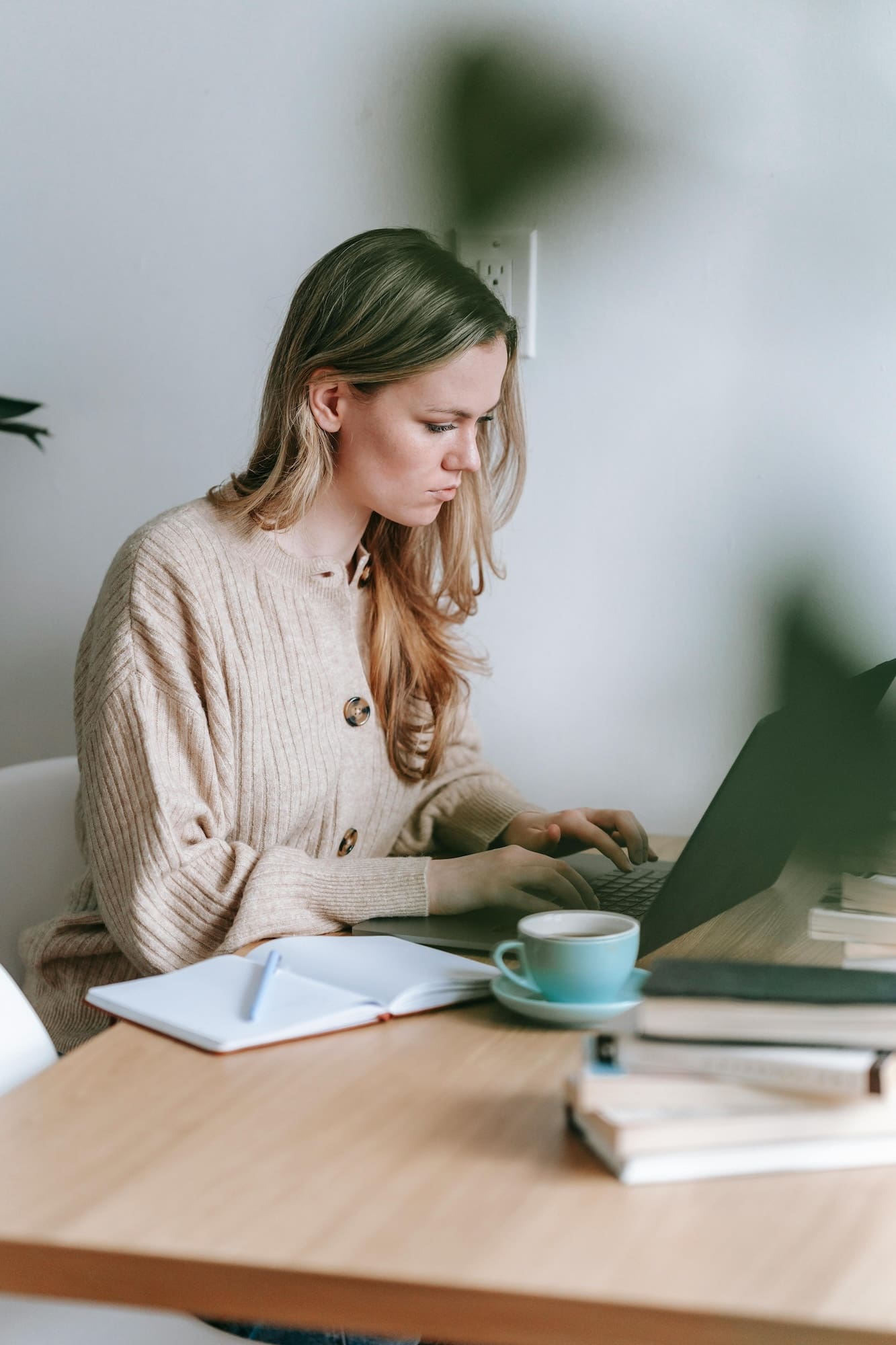 Woman working at computer selecting fonts for her website